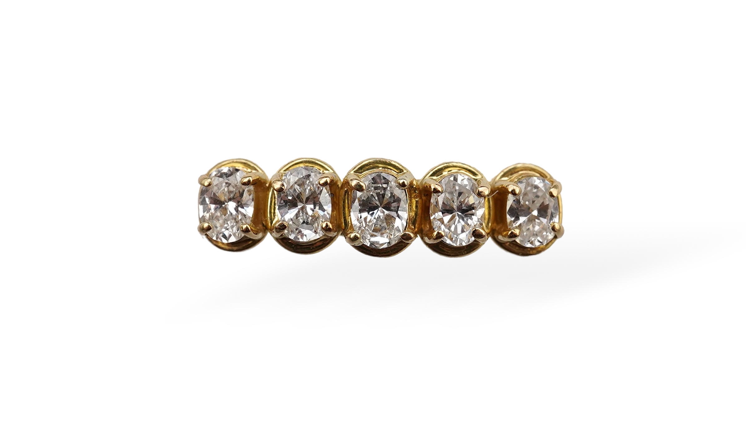 An oval diamond five-stone ring, totalling approximately 0.50 carats, mounted in 18ct gold, size M1/2, British hallmarks, gross weight approximately 3.5 grams